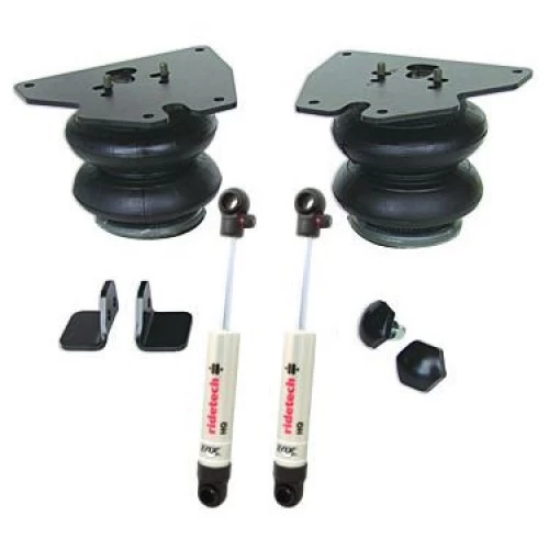 A set of two Front CoolRide Air Spring and Shock Kits | 1988-2000 C3500 and a pair of rubber hoses.